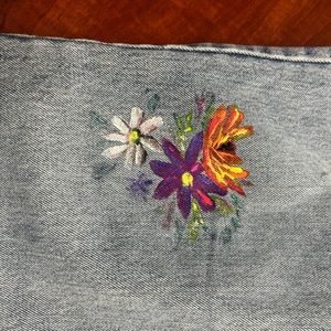 Vintage distressed Levi’s with hand painted design.